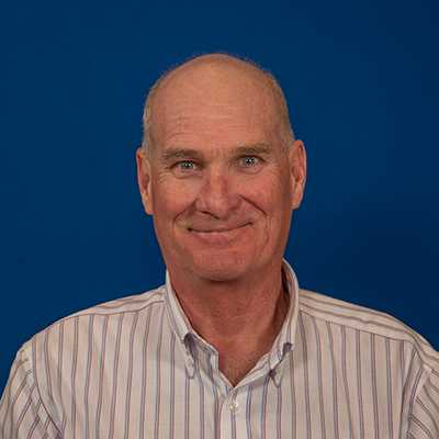 A bald white male in his late 60s.